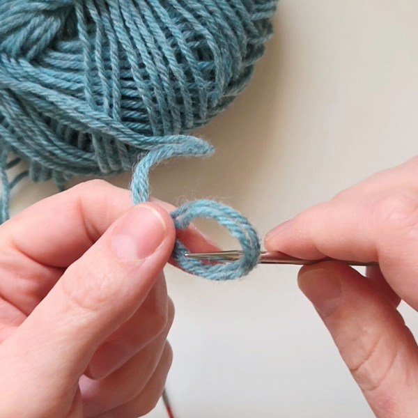 hands casting on yarn